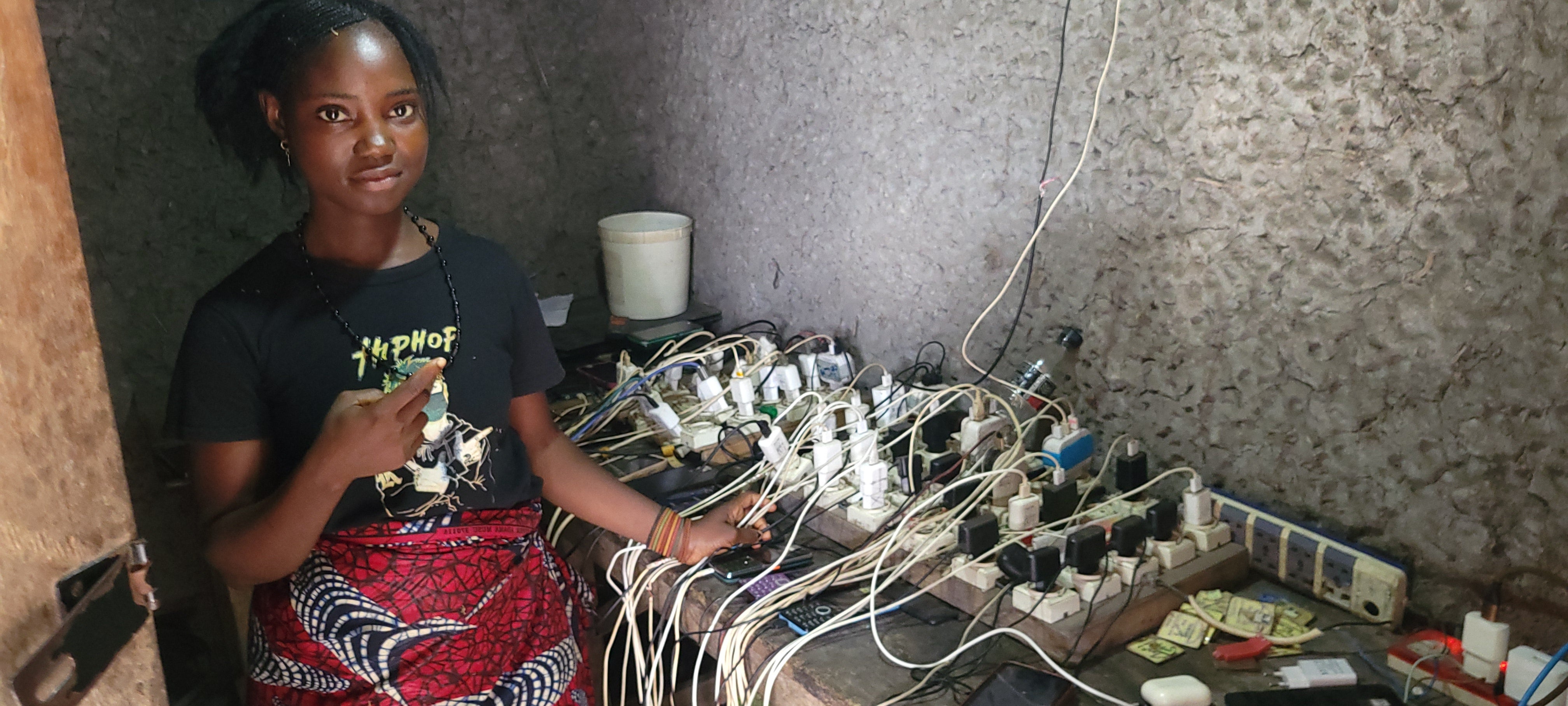 Isata’s mobile phone charging station (L) & Generator (R) in Tengisan community, Bonthe Sherbro River Estuary , Sierra Leone.       