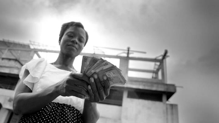 Woman receives loan in Ghana