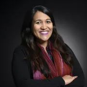 headshot of woman in dark jacket