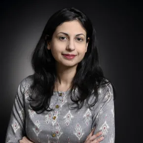 headshot of woman in gray shirt 