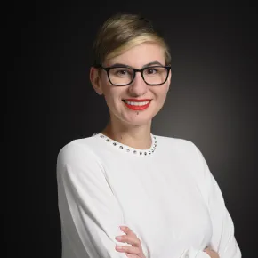 headshot of woman in white shirt