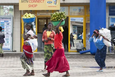 Women walk through the street in Rwanda