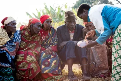 Burundi farmers learn about solar lamps. Photo by Hailey Tucker, 2016 CGAP Photo Contest.
