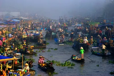 Small business owners in the floating market in Vietnam