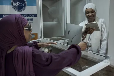 Two women exchange money