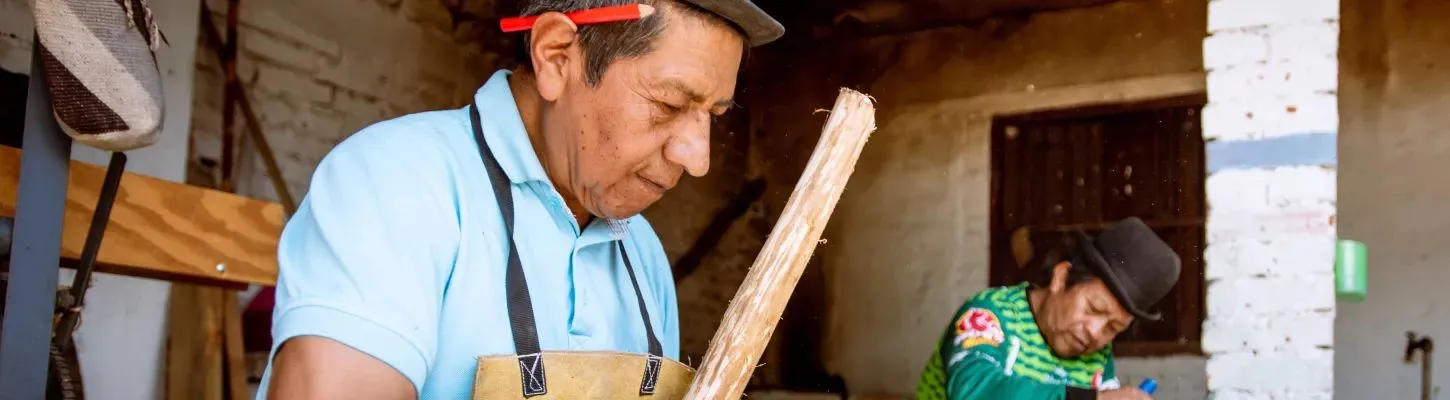 A carpenter working with wood