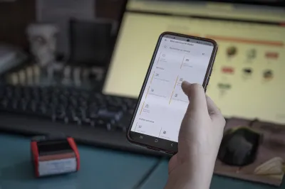 A hand holding a smartphone