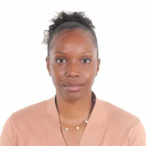 headshot of woman in pink shirt against white backrgound