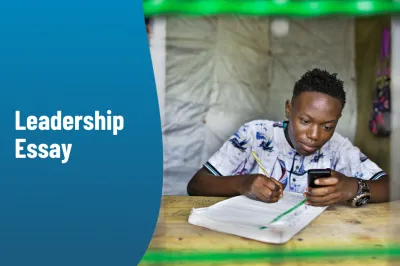 A boy looks at his smartphone