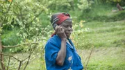 A woman farmer talks on the phone
