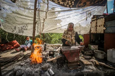 A woman works with metal tools